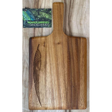 A wooden rectangle board with a paddle handle and a leaf etched into the board on the left.