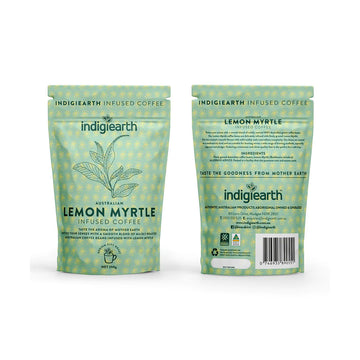 Two packets pictured, the left one is showing the front and the right one is showing the back. They are green with a yellow pattern printed. The front has a line drawing of a plant and the text 'Australian Lemon Myrtle Infused Coffee' written. The back has more product information.