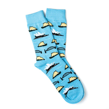A pair of blue socks printed with the Sydney Opera House, the Sydney Harbour Bridge and a boat.