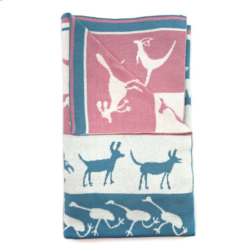 A blue, pink and white baby blanket is folded up with the corner folded over showing the back.