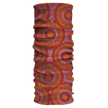 A tubular fabric printed with artwork by Beryl De Rose in red and orange dots forming larger circles together.