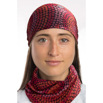 A tubular fabric printed with artwork by Beryl De Rose in red and orange dots forming larger circles together.