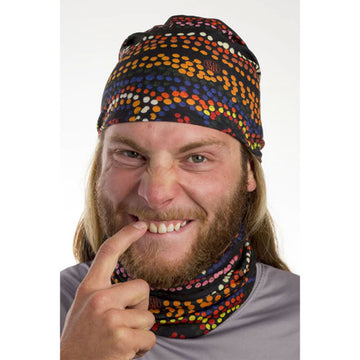 A tubular fabric printed with artwork by Sheila Yakka Jones. The artwork features multicoloured dots on a black background.