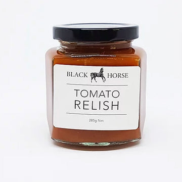 A clear jar with a black lid and white label. The label says 'Black Horse Tomato Relish with an image of a horse at the top. The relish can be seen through the jar.