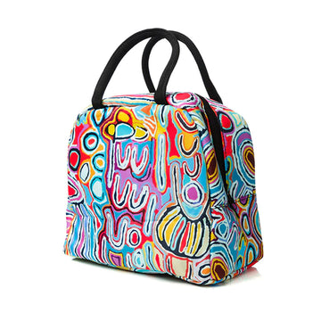 A lunch bag with black handles and printed with artwork by Judy Watson.