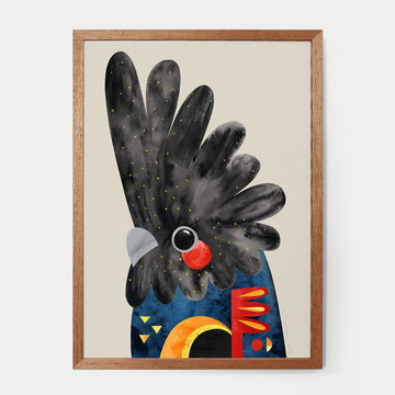 A print of a red tailed black cockatoo illustrated by Pete Cromer inside a wooden frame.