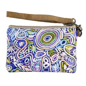 A zippered pouch with a brown wrist strap and a multicoloured print on the front with artwork by Cedric Varcoe.
