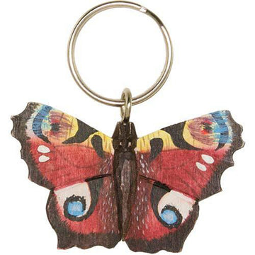 A handcarved wooden butterfly with a keyring attached. The butterfly has been painted red and yellow with blue and brown details.