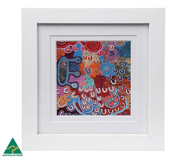 Colourful print 10cm x 10cm of a painting by Warlukurlangu artist Ada Dixon. Australian Made, presented in a white frame 18.4cm x 18.4cm behind perspex glass.