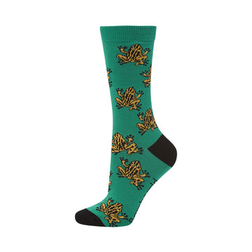 A green sock is pictured with a black heel and toe and yellow corroboree frogs printed on it.