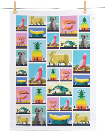 A tea towel printed with a repeat grid design of large Australian objects including the big pineapple, the big banana and the big koala.