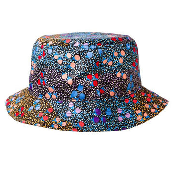 A bucket hat featuring artwork by Charlene Marshall in blue, orange and red. The artwork has a base of small dots with larger dots on top.