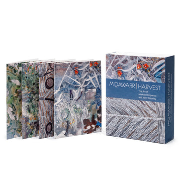 Boxed card pack featuring the paintings of Yolngu elder Mulkun Wirrpanda and landscape painter John Wolseley. Midawarr Harvest is in text and four of the cards are to the left.