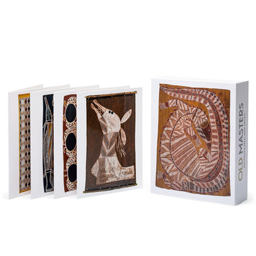 Glossy white, gift boxed set of twelve cards featuring a crocodile bark painting. Old Masters printed in black and gold on the side. Four cards are standing to the left.