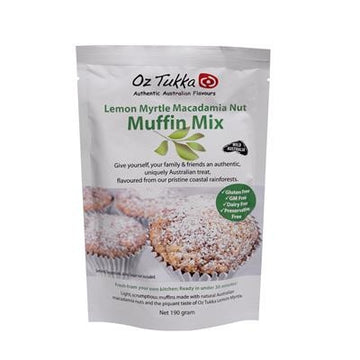 A white packet of muffin mix featuring product information with a photo of three muffins.