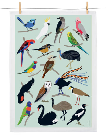 A tea towel printed with all different birds is hanging off a wire.