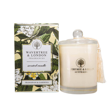 Candle by Wavertree and London. Frangipani and Gardenia. Clear Glass jar packaged in a green and white floral box.