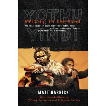 'Writing in the Sand' book cover featuring a photo of two men singing and dancing. The book title is written in orange with 'Yothu Yindi written in the background.