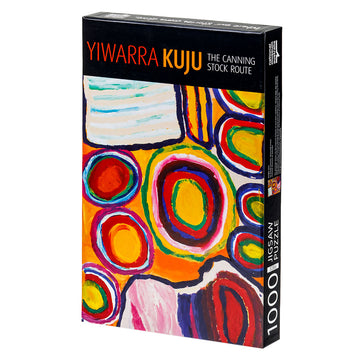Angle view of box cover of 'Yiwarra Kuju' 1000 piece puzzle featuring artwork of circles in yellow, red and blue.