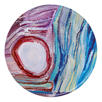 Plate featuring the artwork Parnngurr Rock Hole 2015 by Bugai Whyoulter, Martumili Artists in the colours red, purple and blue.
