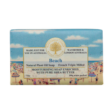 Soap Beach. Off side picture of a soap bar with an image of a beach, people and umbrellas and a blue sky with clouds.