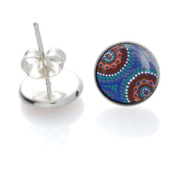 Round, sterling silver backed stud earrings in front and rear view. Features artwork, Camping Around Waterholes, by Kathleen Buzzacott. Blue background; brown brushstrokes; green, orange, white dot art. Australian made.