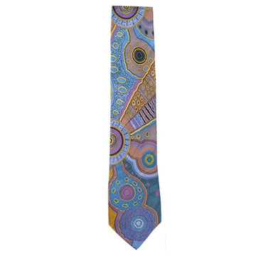 A tie featuring artwork by Norman Cox in blue, purple and yellow.