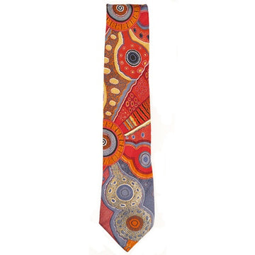 Australian made polyester printed tie. Artwork by Norman cox titled Kanga Story. Brightly coloured mostly red, orange, and blue tones. Connected circles and lines and swirling pattern.